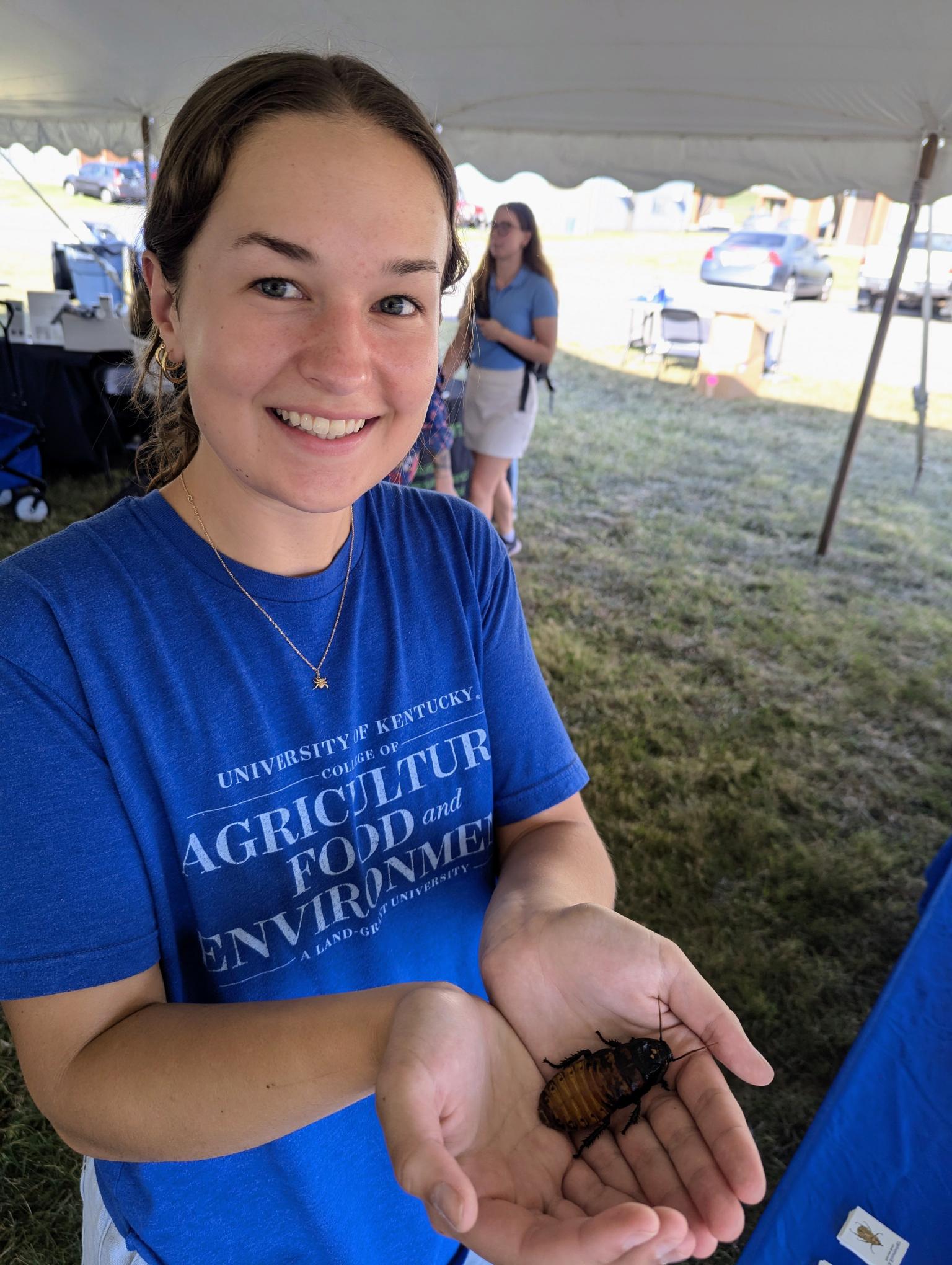 Gracie holding cockroach